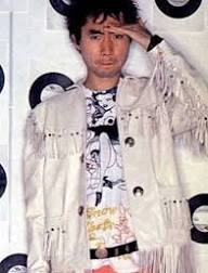 Tosh in fringed white jacket
